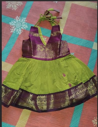 Customer photo review of Green and wine tie up dress for baby girl