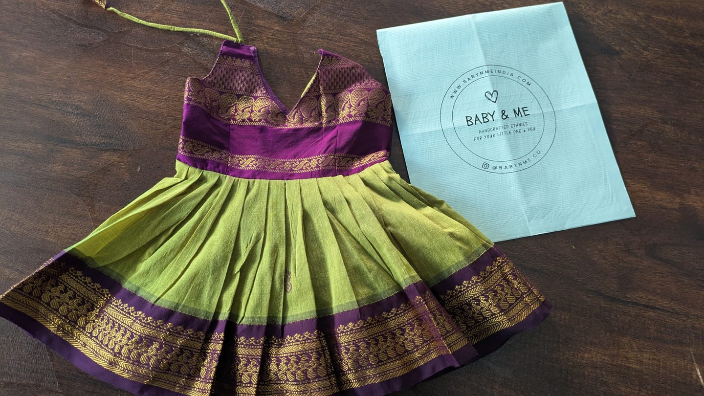 Customer photo review of Green and wine tie up dress for baby girl