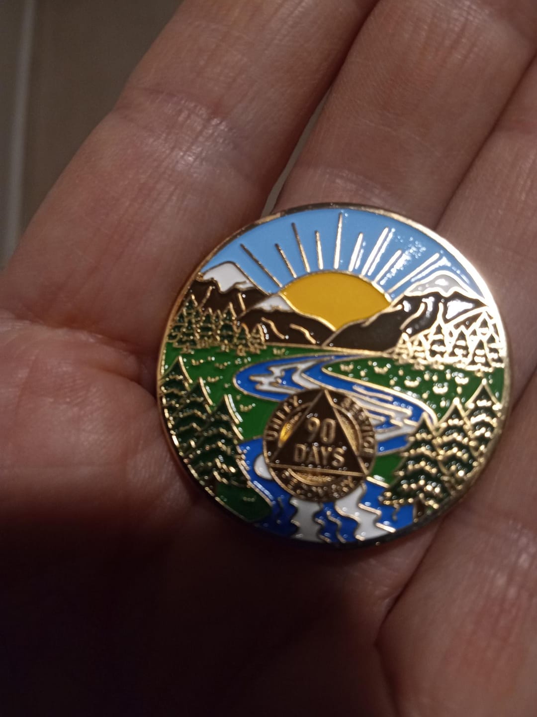 Customer photo review of 1 to 65 Year Sobriety Mint Winding River Gold Plated AA Recovery Medallion/Chip/Coin
