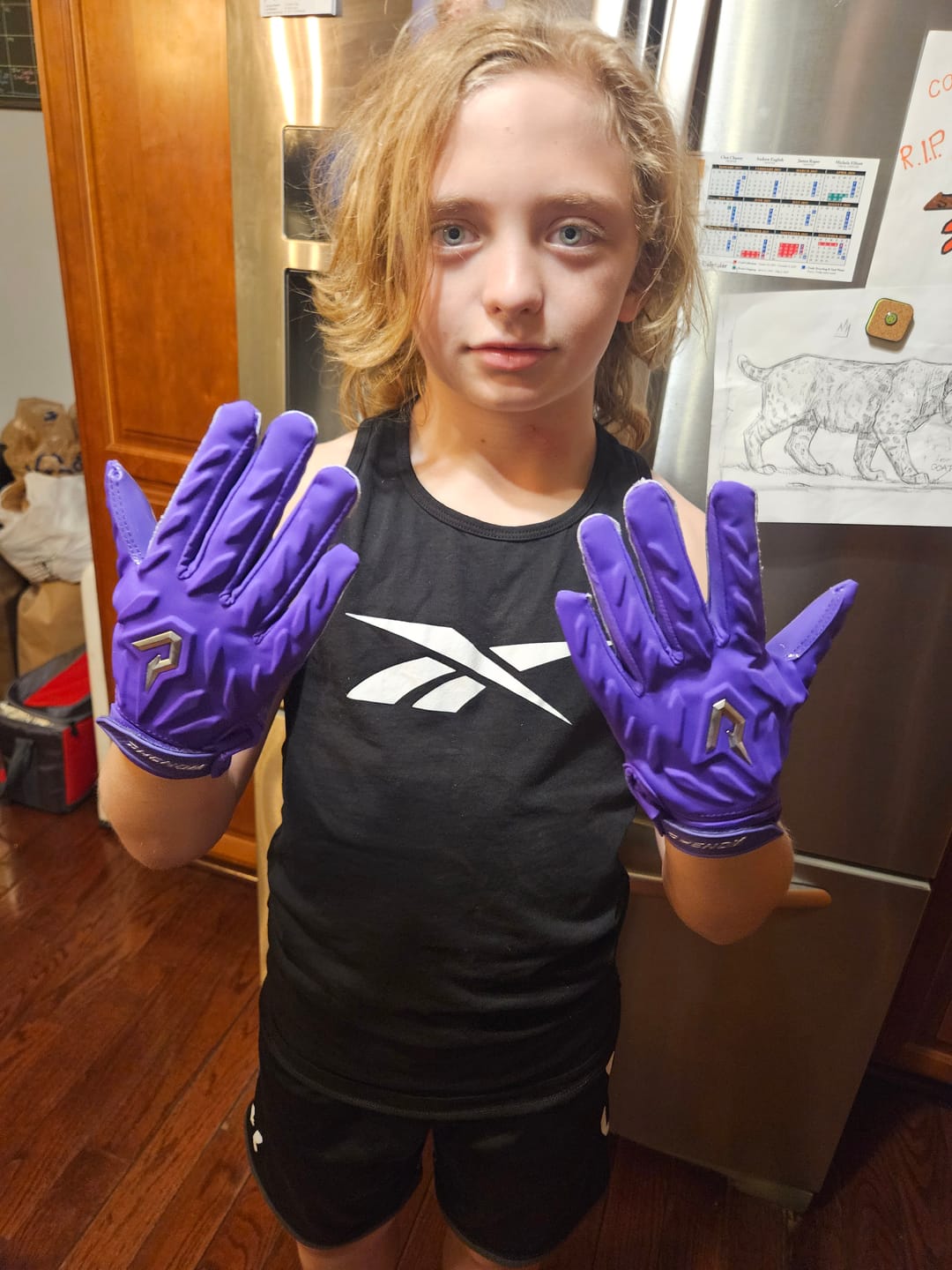 Customer photo review of Phenom Elite Quantum Fierce Youth Padded Football Gloves - Team Colors