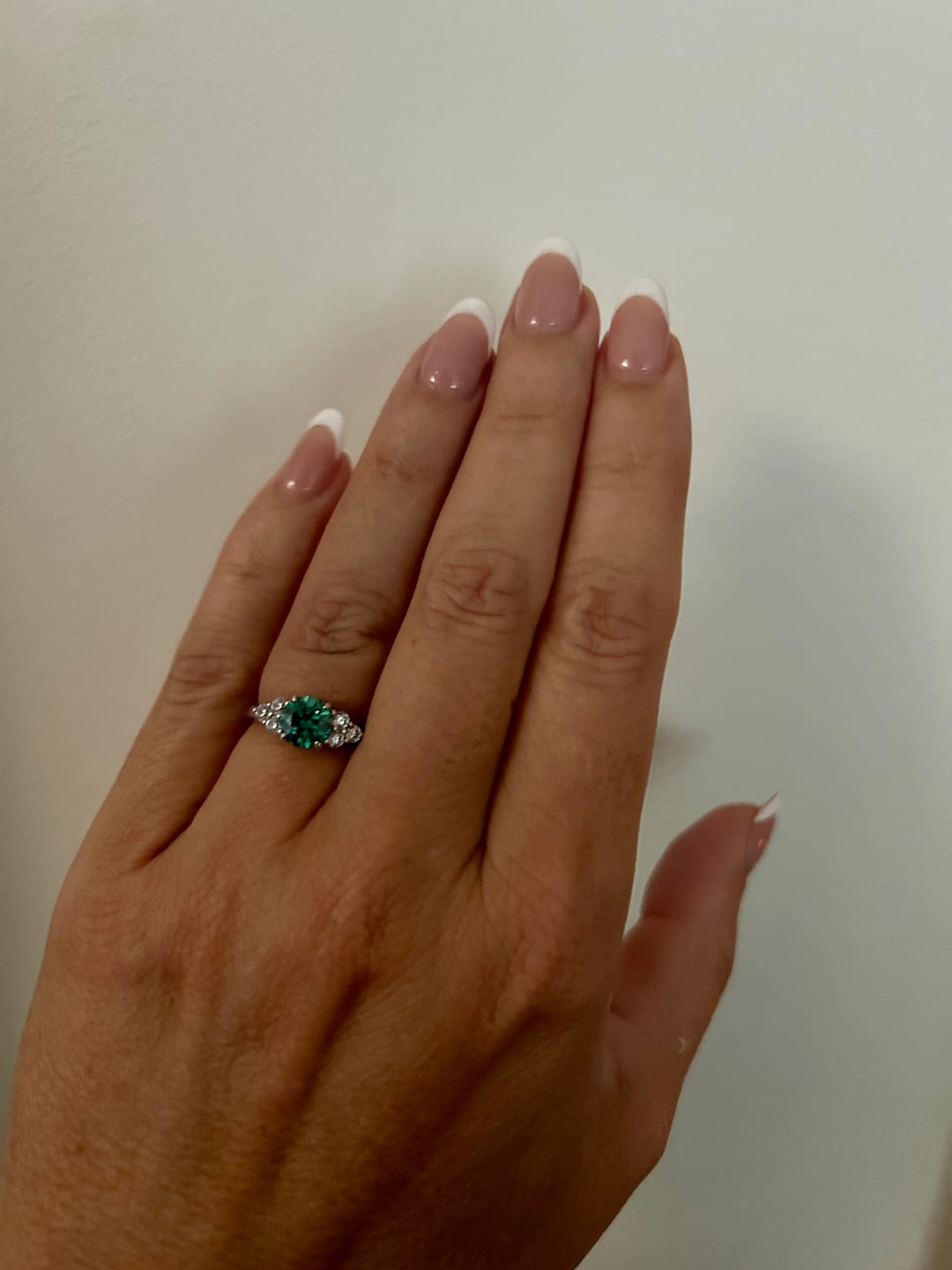 Customer photo review of Green Moissanite Side Stone Engagement Ring