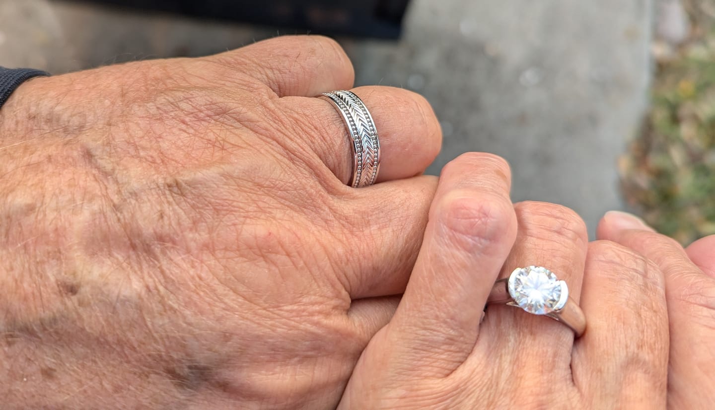 Customer photo review of Solitaire Moissanite Half Bezel Set Sterling Silver Engagement Ring