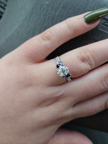 Madelyn H. review of Oval Moissanite And Graduated Blue Sapphire Clusters Engagement Ring image 1 out of 1