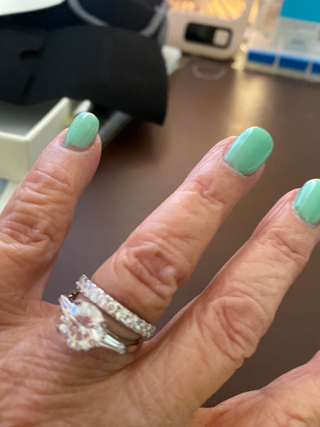 Customer photo review of Three Stone Round Moissanite Tapered Baguette Engagement Ring
