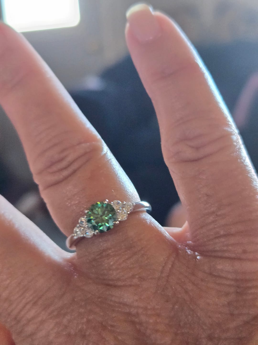 Customer photo review of Green Moissanite Side Stone Engagement Ring