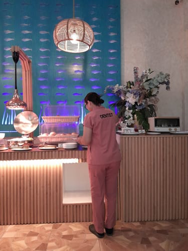 Customer photo review of Zip-Up Polo MoveTech® Scrub Top - Women / Saffron