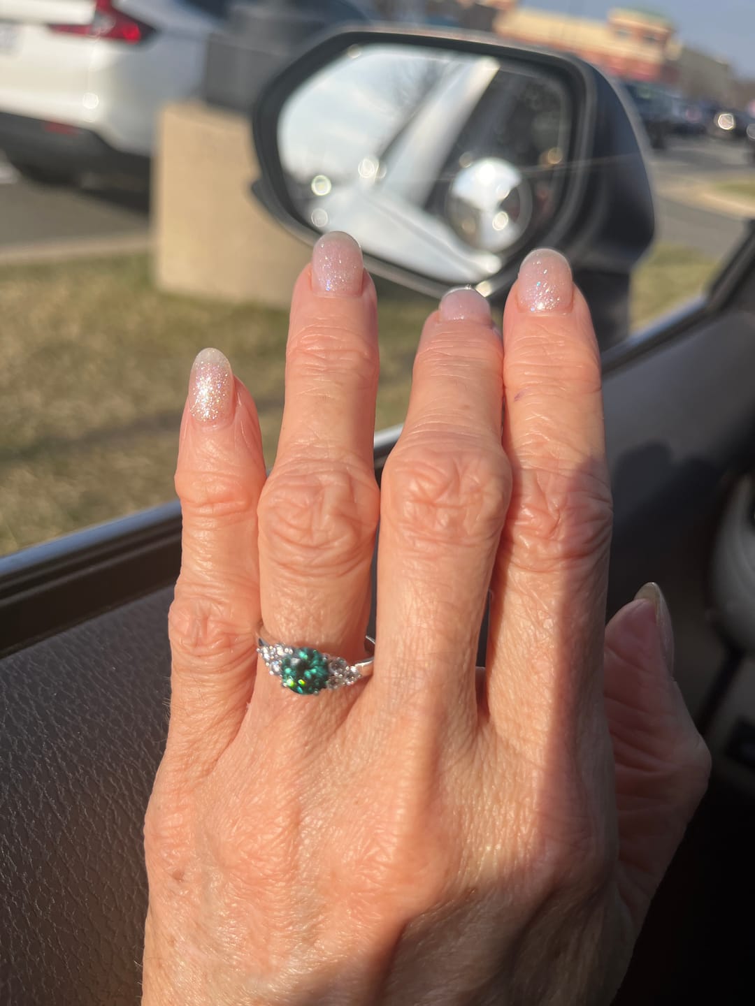Customer photo review of Green Moissanite Side Stone Engagement Ring