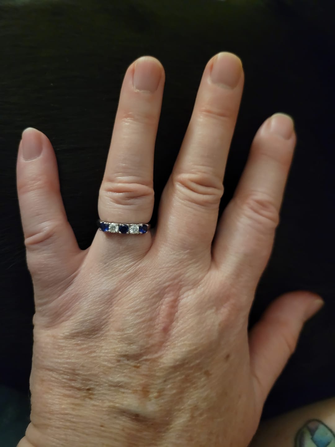 Customer photo review of Five Stone Moissanite and Sapphire Wedding Band Ring In Sterling Silver