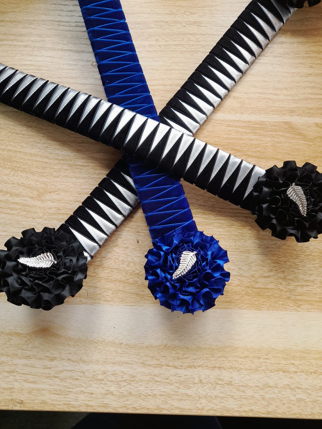 Customer photo review of Silver Fern Pinback Badge