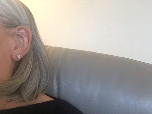 Customer photo review of Trinity Moissanite Sleep Stud Earrings