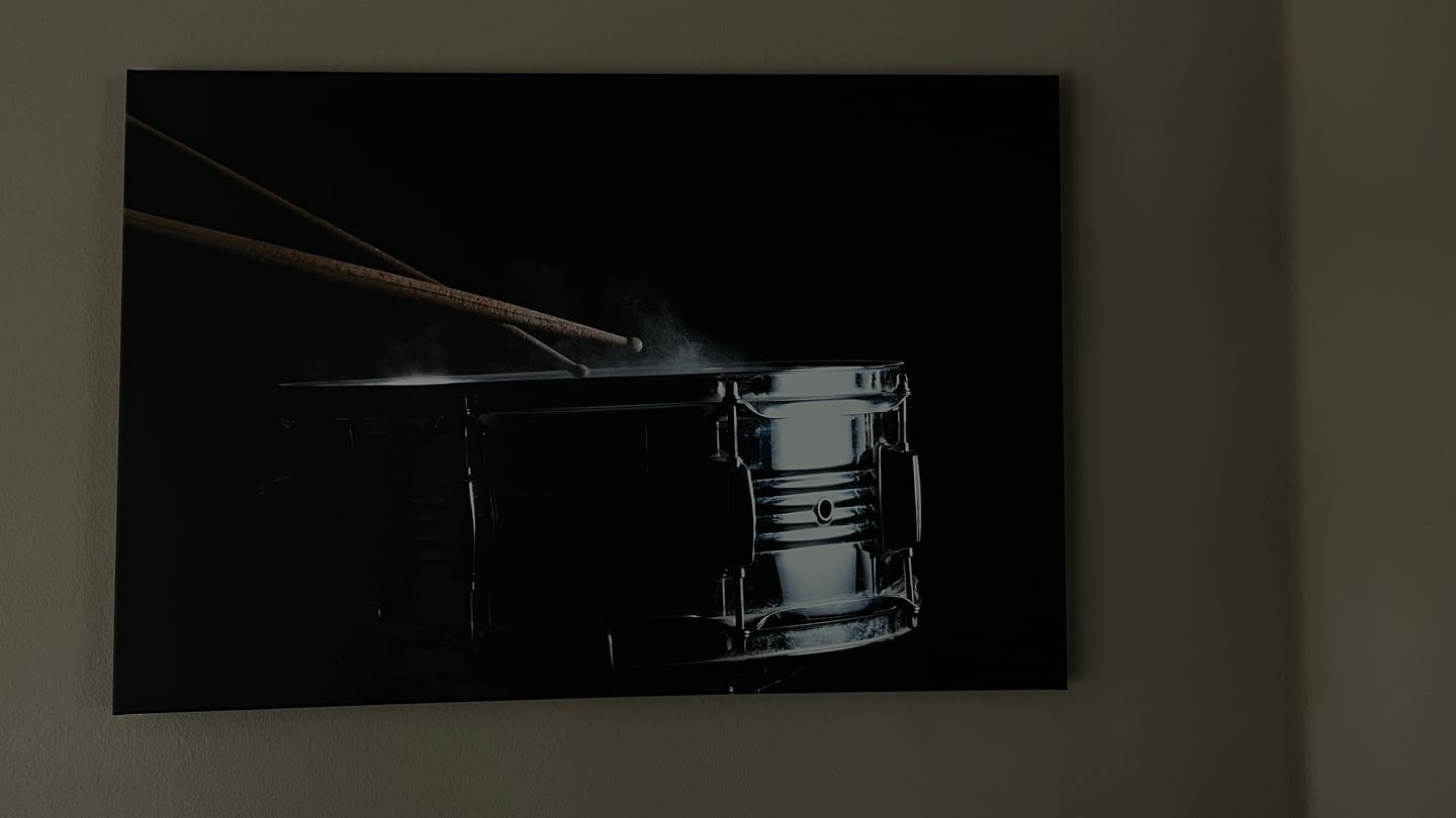Customer photo review of Drum sticks hit on the snare drum in black background, close-up, low key №3276 Ready to Hang Canvas Print