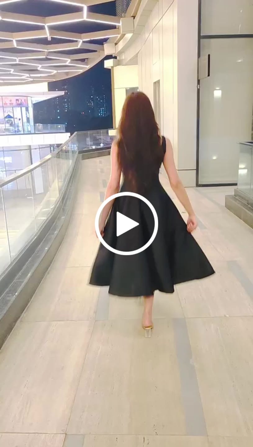 Customer video review of Rigata Holiday Statement Maxi Dress in Black