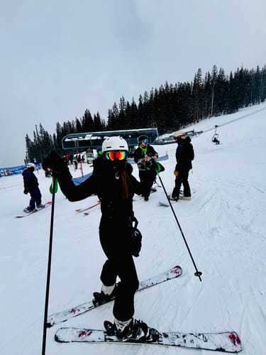 Customer photo review of Women's Slim-Fit Stretch Faux Fur Black One-Piece Ski Suit