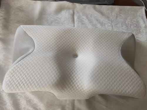 Customer photo review of Ultimate Ergonomic Neck Pillow - 2-in-1 Contour Memory Foam Support for Pain Relief