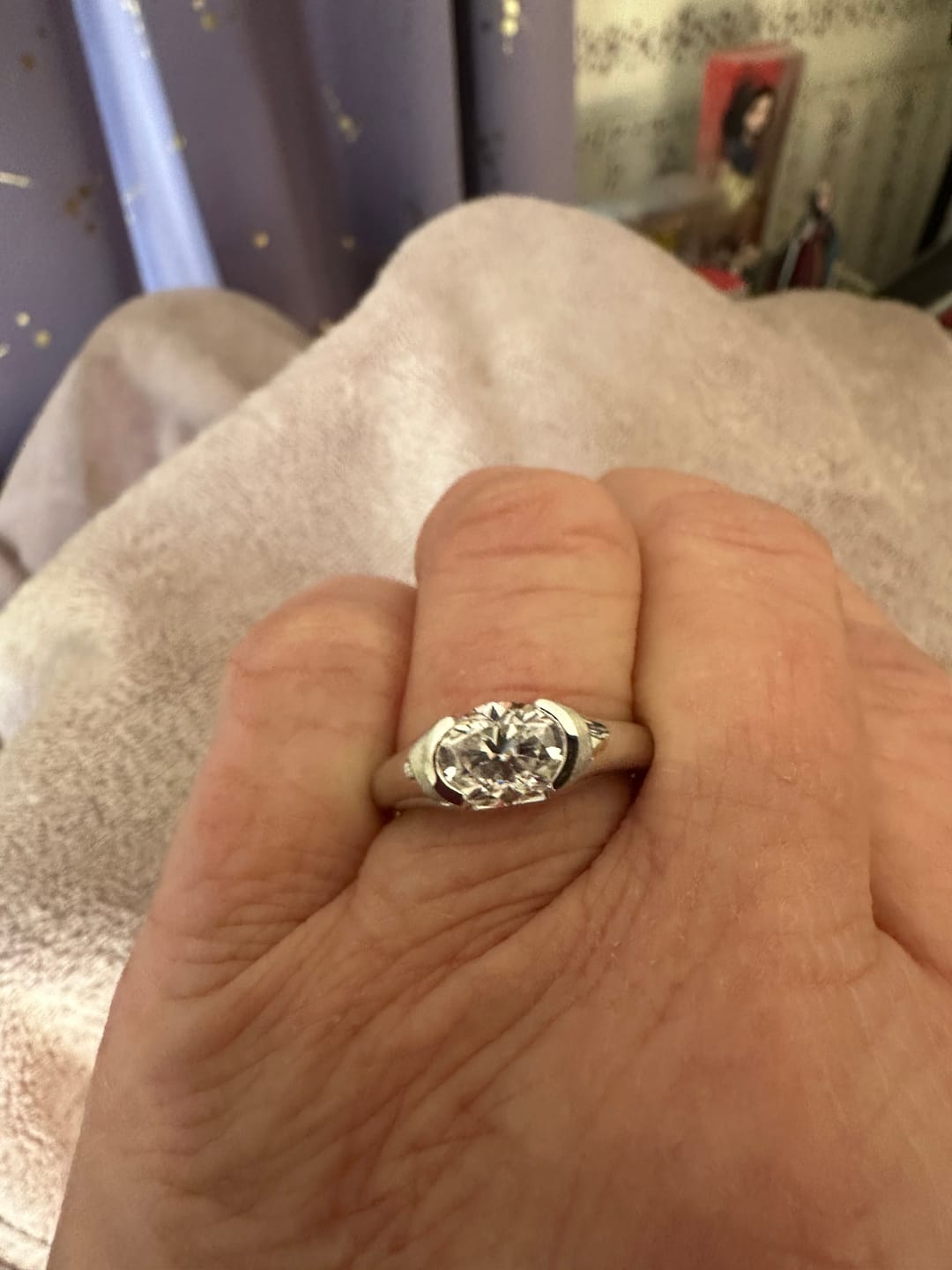 Customer photo review of Solitaire Oval Moissanite Half Bezel Set Engagement Ring