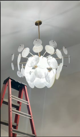 Customer photo review of Modern 9-Light White Strie Glass Tiered Chandelier