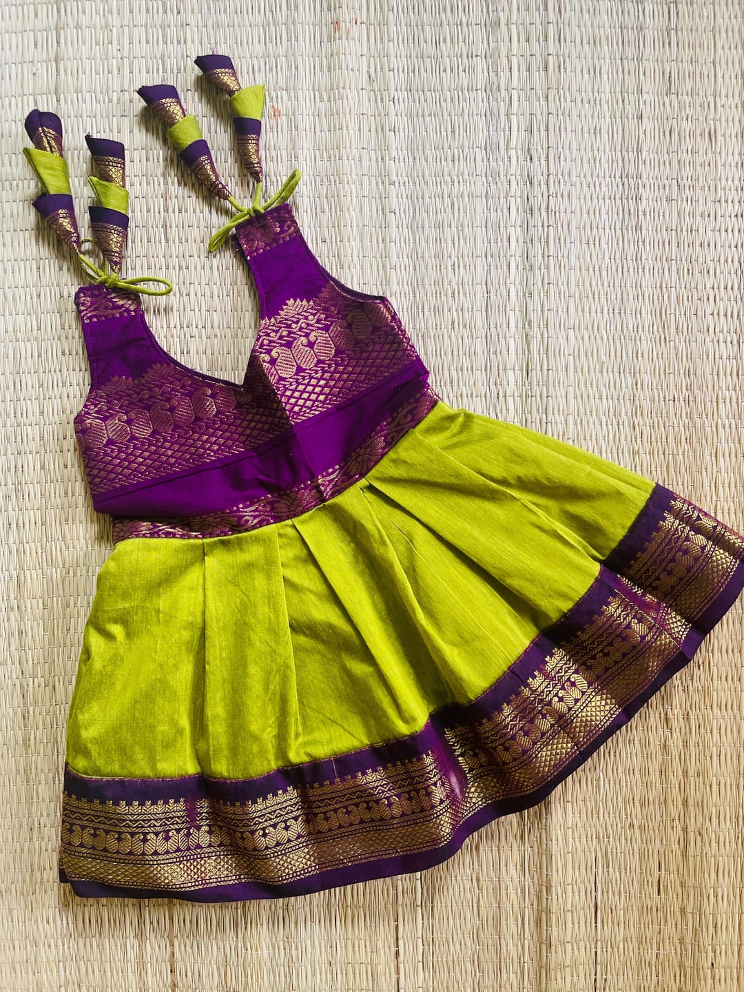 Customer photo review of Green and wine tie up dress for baby girl