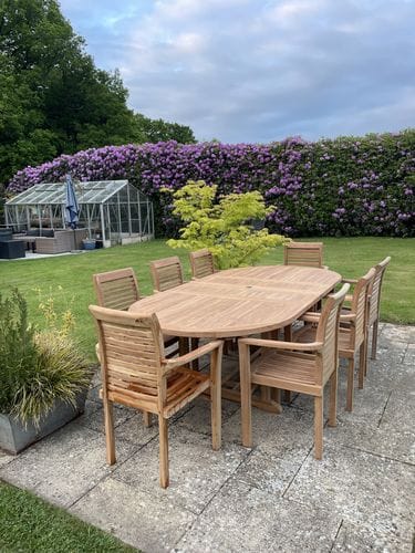 Customer photo review of Teak Oval 180-240cm Extending Table 4cm Top (8 Oxford Stacking Chairs) cushions included.