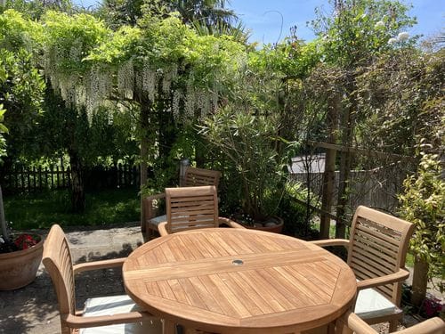 Customer photo review of Teak Round to Oval 120-170cm Extending Table, 4cm Top (6 Oxford Stacking Chairs) cushions included.