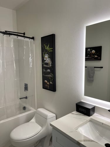 Customer photo review of Tall Narrow Vertical Zen Stacked Rocks, Candle and Bamboo Framed Canvas Wall Art