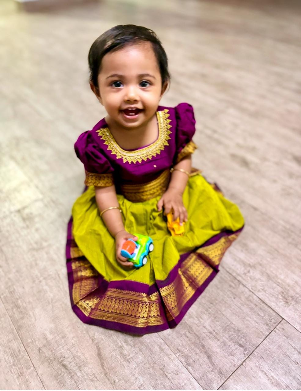 Customer photo review of Green and wine traditional langa blouse embroidered zari border dress for baby girl (100% Pure Cotton)
