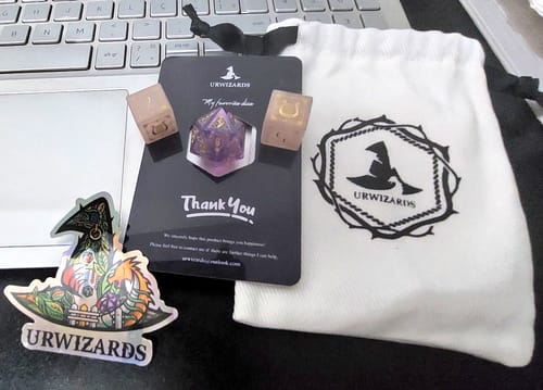 Customer photo review of URWizards D&D Rose Quartz Engraved Dice Set Bard