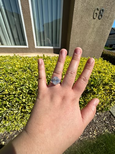 Customer photo review of M & Co. 5 CT Oval with Epaulette Accents Three-Stone Engagement Ring