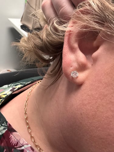 Customer photo review of M & Co. 4-Prong Martini Setting Diamond Stud Earrings