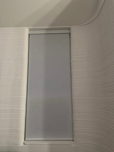 Customer photo review of SmartWings Motorized Light Filtering Roller Shades 70% Blackout Essential