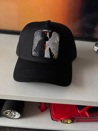 Customer photo review of Conflicted Angel - "conflict" trucker hat