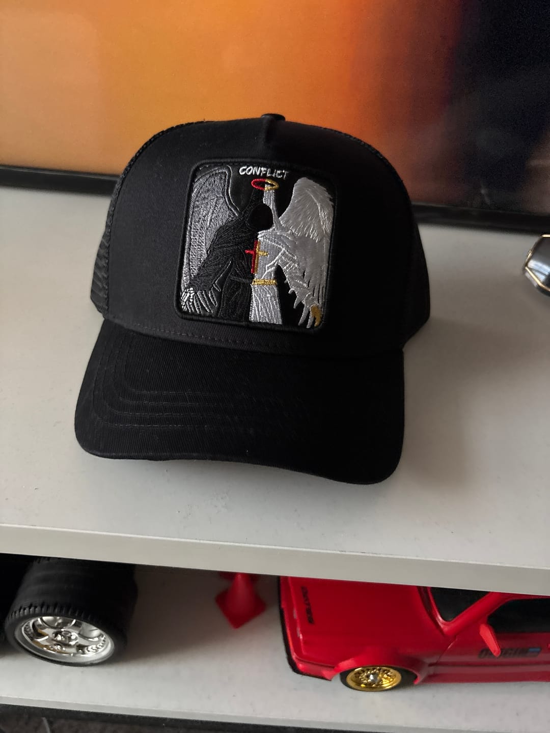 Customer photo review of Conflicted Angel - "conflict" trucker hat