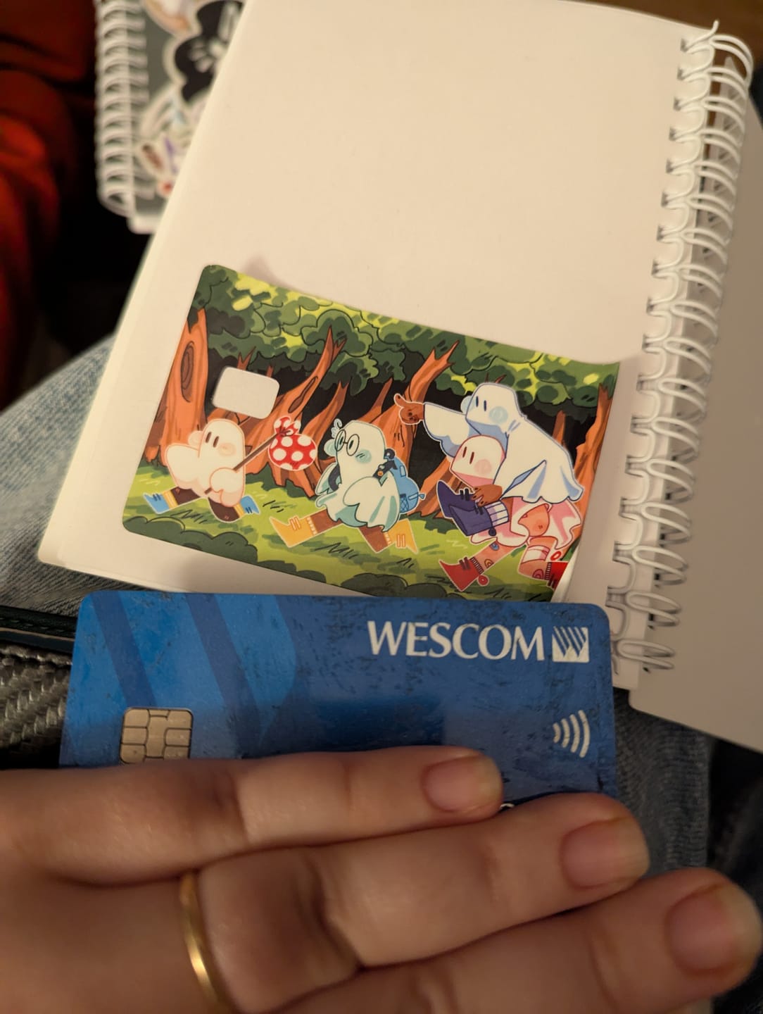 Customer photo review of Runaway Ghosts Credit Card Skins