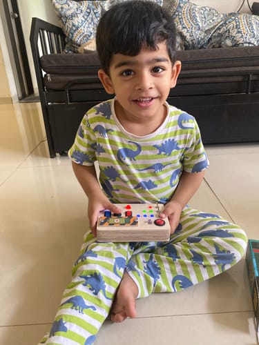 Customer photo review of Toggle Play Montessori Busy Board-V6