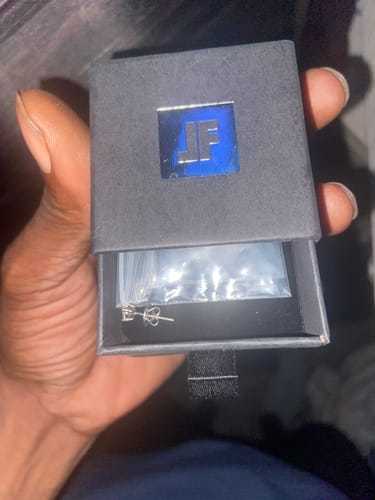 Customer photo review of VVS Moissanite Solitaire Stud Earrings