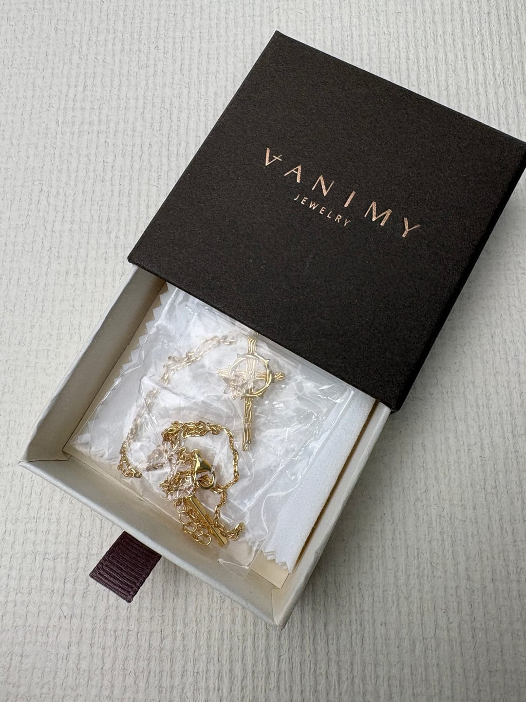 Customer photo review of Crown of Thorns Lily Cross Pendant Necklace