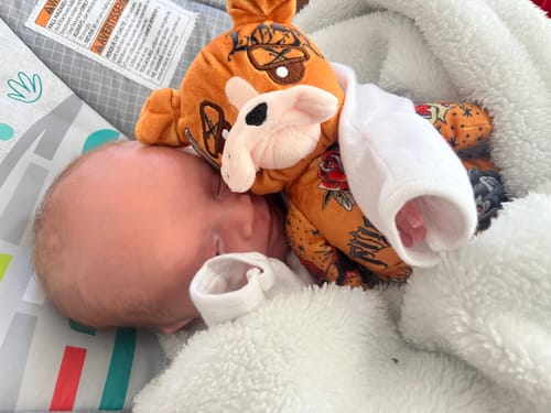 Customer photo review of Buddy the Monkey Enamel Pin