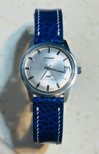 Blue ostrich leg leather watch strap with deployant clasp on a 1968 Longines Ultra-Chron