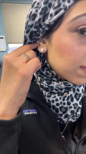 Customer photo review of M & Co. 4-Prong Martini Setting Diamond Stud Earrings