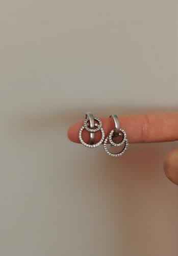 Customer photo review of Silver Huggie Hoop Earrings with Dangling Zirconia Circles
