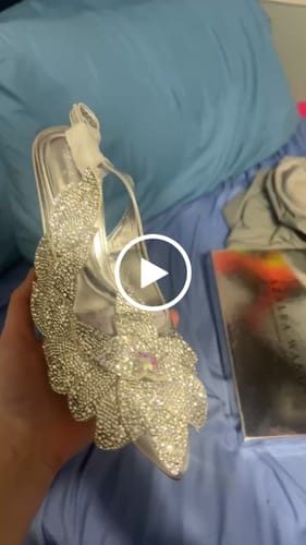 Customer video review of WEATHERLY-SILVER OVERSIZED FLOWER SLINGBACK PUMP