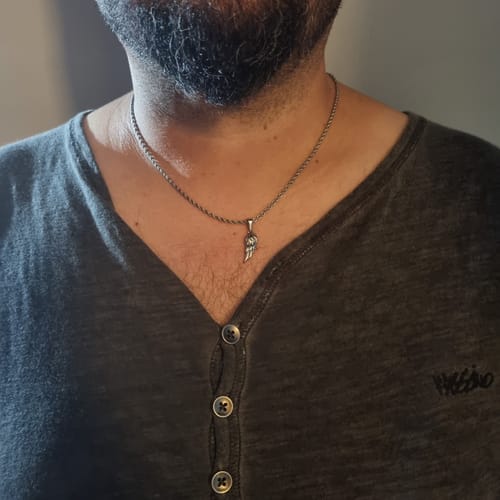 Reseña con foto de un cliente sobre Hermés Pendant