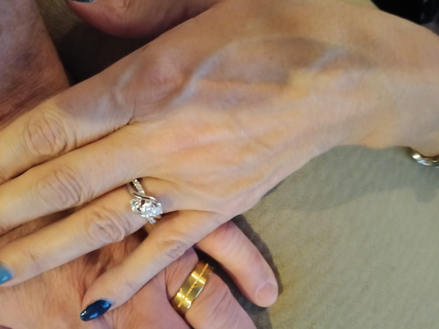 Customer photo review of Swirl Three Stone Moissanite Twisted Pave Engagement Ring