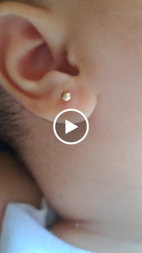 Customer video review of Newborn Ball (3mm) 14K - YG (Piercing)