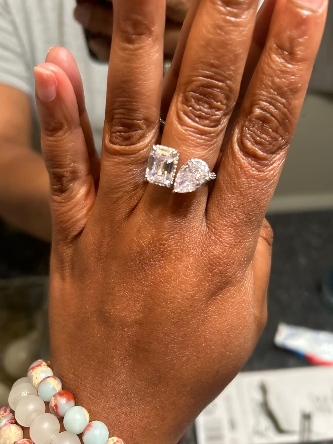 Customer photo review of Louily Unique Double Stones Design Emerald Cut & Pear Cut Engagement Ring