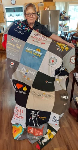 T-shirt quilt with giving blood, humanitarian work themes by Melba from WA
