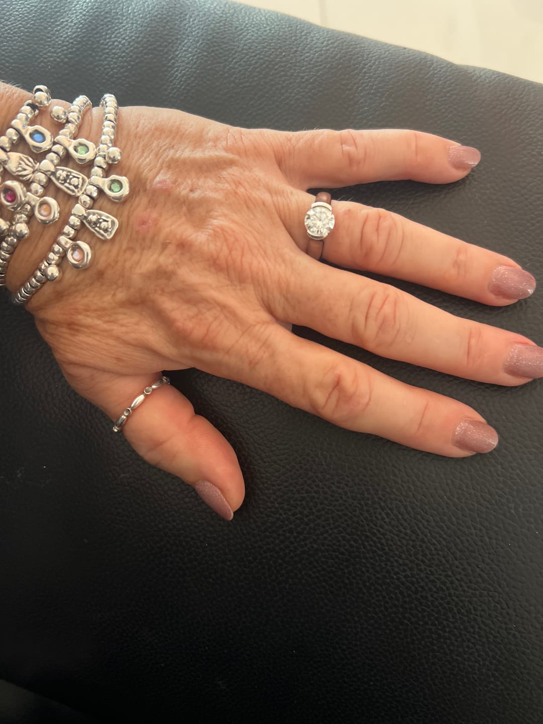Customer photo review of Solitaire Moissanite Half Bezel Set Sterling Silver Engagement Ring