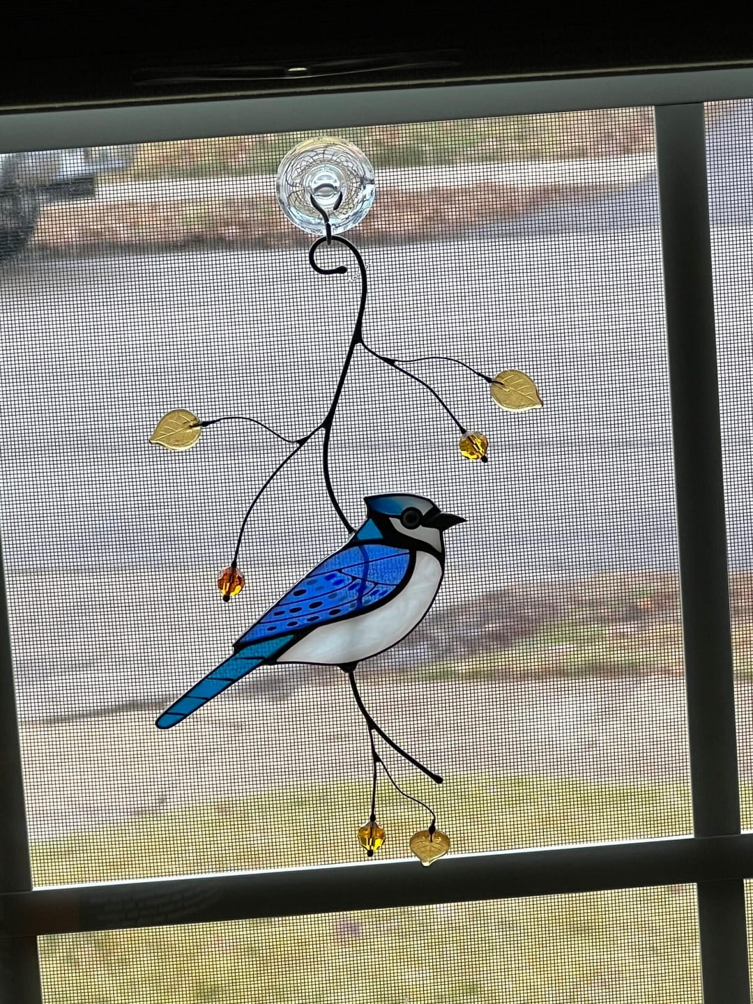 Customer photo review of Blue Jay stained glass bird realistic on a branch
