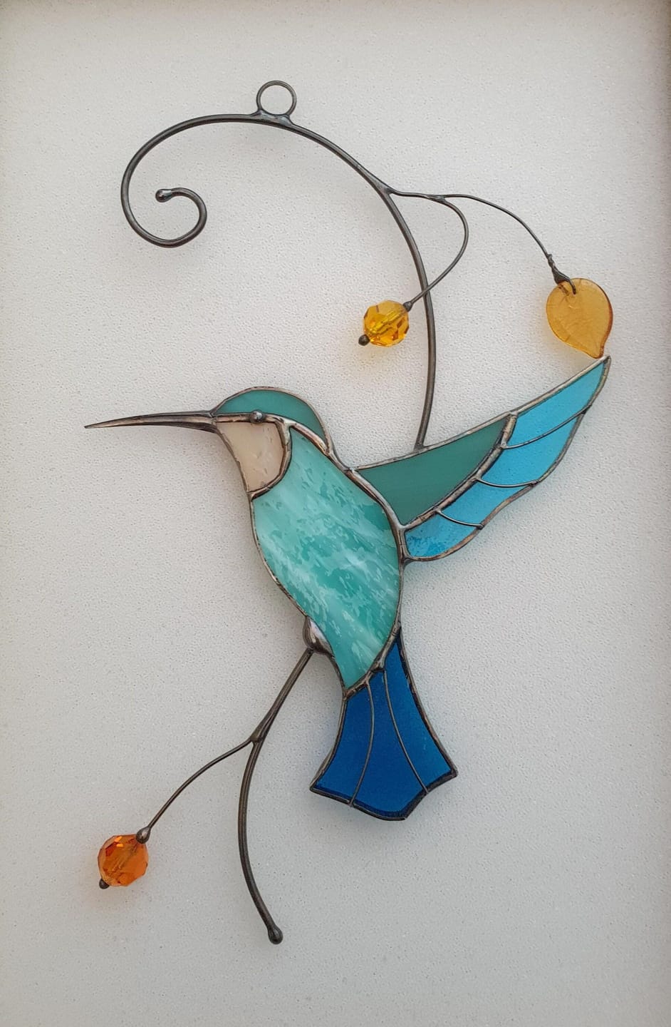 Customer photo review of Hummingbird Taking Off from a Branch suncatcher