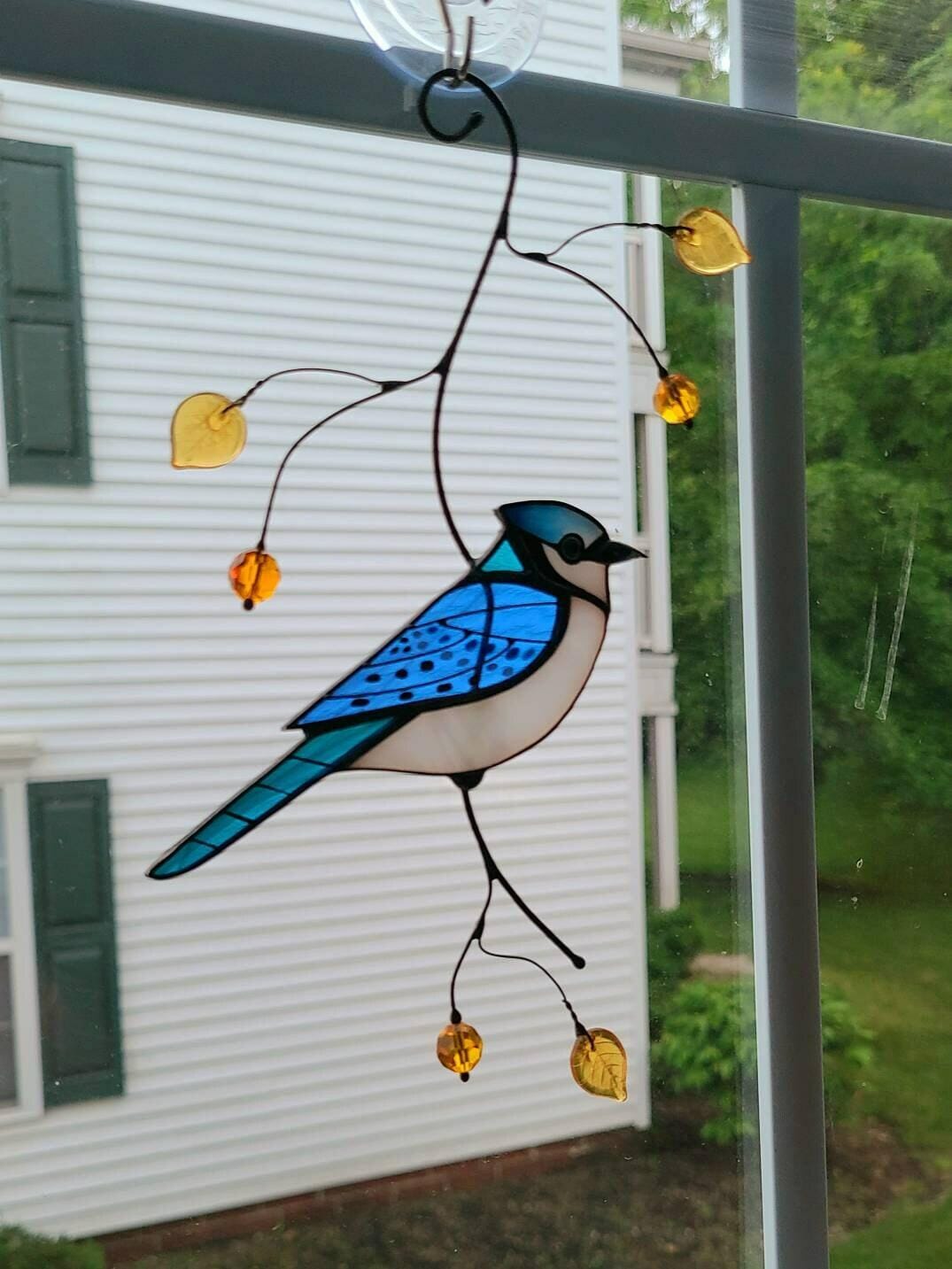 Customer photo review of Blue Jay stained glass bird realistic on a branch