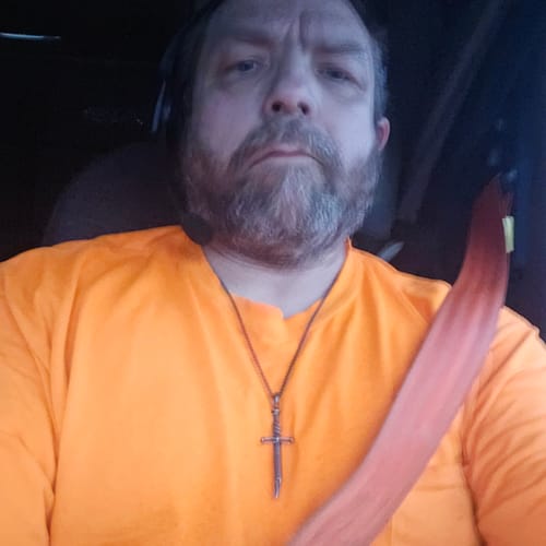 Customer photo review of Legacy of Courage Broken Sword Necklace Stainless Steel: Helps Pair Veterans With A Service Dog Or Shelter Dog